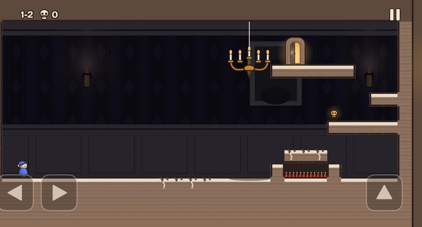 Level 1-2: a blue nightcap doll at the left of a dark panelled hall, a candle chandelier hanging from a string, cracked tiles on the floor and a small gold skull on a ledge near the exit door.